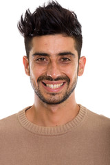 Fototapeta premium Face of young happy Persian man smiling