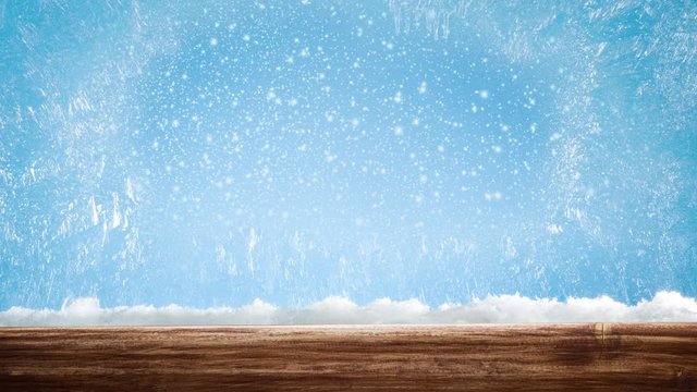 Frozen window with patterns on it. Outside the window it is snowing on a blue background. Beautiful background for the holidays Christmas or New Year.