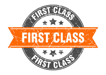 first class round stamp with orange ribbon. first class