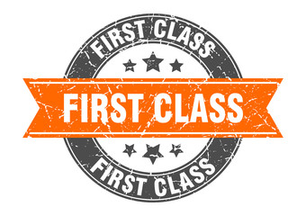first class round stamp with orange ribbon. first class