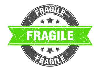 fragile round stamp with green ribbon. fragile