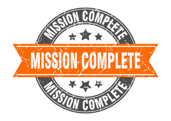 mission complete round stamp with orange ribbon. mission complete