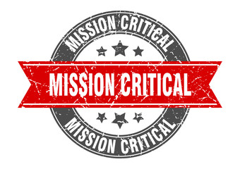mission critical round stamp with red ribbon. mission critical