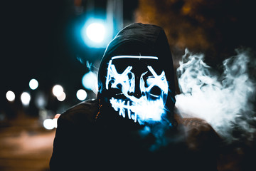 A scary mask in smoke.