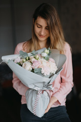 girl with a bouquet of flowers in her hands