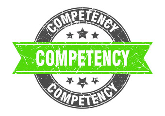 competency round stamp with green ribbon. competency