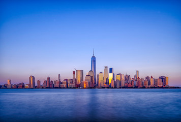 Fototapeta premium Manhattan skyline view from New Jersey Exchange Place during sunset hour