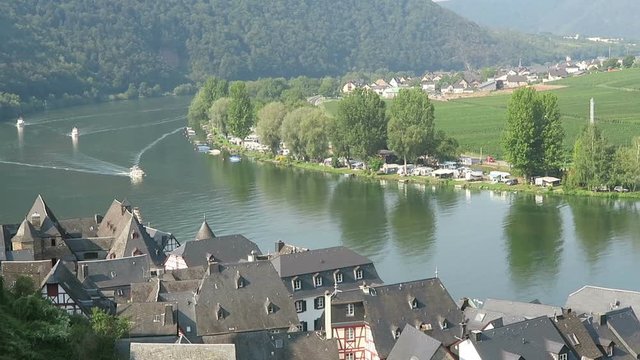 Cityscape of Beilstein at Moselle river. Boats on riving.