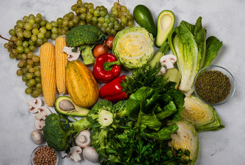 Collection of different fresh raw vegetables on a light background. Top view