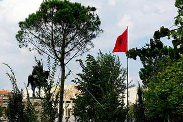 Flag of Albania with a black double-headed eagle in the central square of Skanderbeg in Tirana 