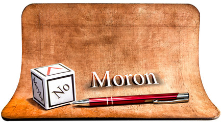 Moron - NO. White paper cube with pen. The concept of the checklist.