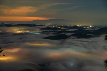 beautiful long exposure landscape of the fog city at midnight with dramatic streets light and...