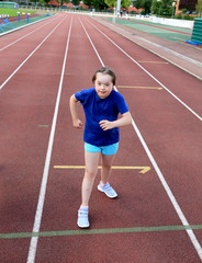Obraz premium Little girl have fun on the stadium