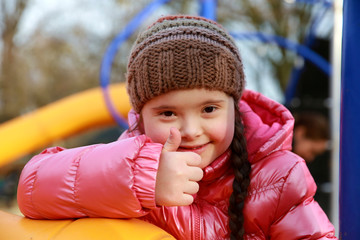 Portrait of beautiful girl on the playground