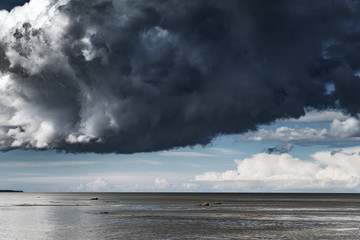 Fototapeta na wymiar Cloudy day by gulf of Riga, Baltic sea.