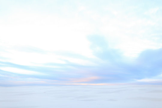White Winter Steppe And Sky With Clouds.