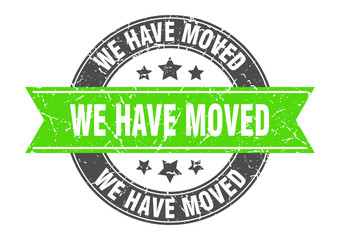 we have moved round stamp with green ribbon. we have moved