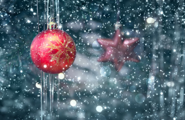 Christmas tree with red ball, isolated on green bokeh background.