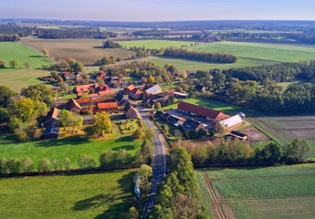Fototapeta na wymiar Aerial view of a tiny piddy village in the heath in the north of Germany