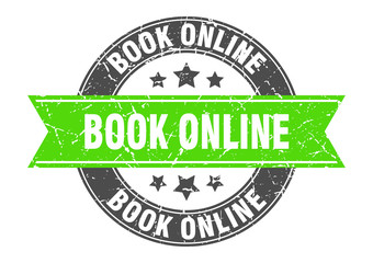 book online round stamp with green ribbon. book online