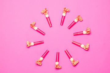 Party Blowers on pink background