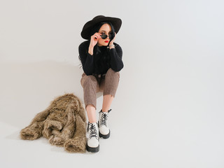 emotional woman posing on a light background. 