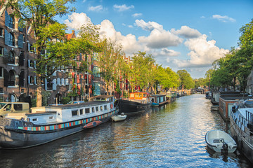 Beautiful views of the streets, ancient buildings, people, embankments of Amsterdam.