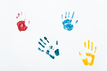 yellow, blue and red hand prints on white