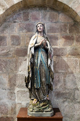 Fototapeta na wymiar view of religious statue inside the Abbey Sainte-Croix in Quimperle