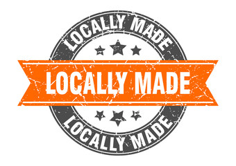 locally made round stamp with orange ribbon. locally made