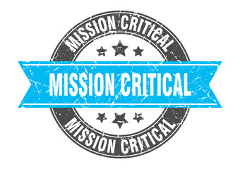 mission critical round stamp with turquoise ribbon. mission critical
