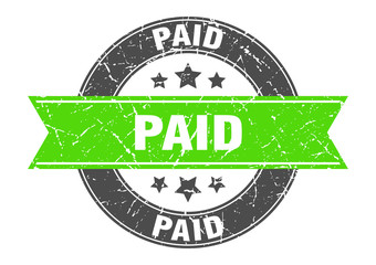 Fototapeta premium paid round stamp with green ribbon. paid