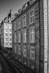 black and white view of historic Norman stone houses in the Saint-Malo Intra-Muros Neighboorhood