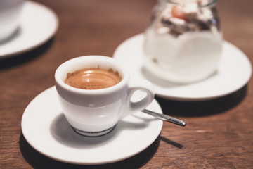 cup of espresso on a wooden table
