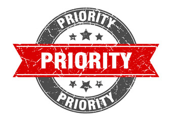 priority round stamp with red ribbon. priority