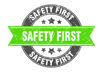 safety first round stamp with green ribbon. safety first