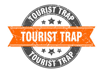tourist trap round stamp with orange ribbon. tourist trap