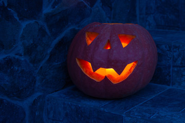 burning pumpkin on the stairs,Halloween night stairs pumpkin carved glowing, with Halloween holiday