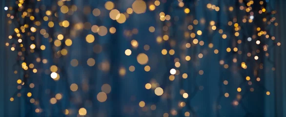 Foto op Plexiglas vakantie verlichting en decoratie concept - kerst slinger bokeh lichten over donkerblauwe achtergrond © Syda Productions