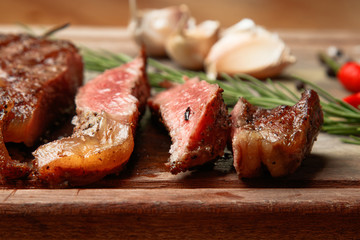 steak from beef, steak with vegetables, proper nutrition, healthy food,  a piece of boiled pork on a wooden board, presentation and serving, rustic style, vegetables for meat, 