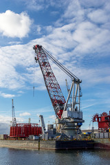 Fototapeta na wymiar Crane to unload containers in the port of Rotterdam, the Netherlands, Europe.