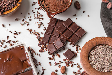 Cocoa beans pods, chocolate bar pieces, cocoa powder