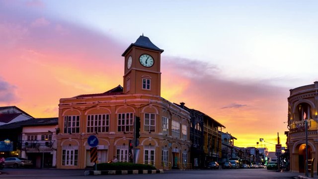 Time lapse video Day to Night old building sino-portuguese style at phuket oldtown with Busy traffic colorful sunset background in travel and transportation concept.