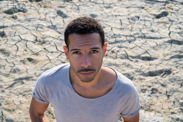 young man looking straight into the camera reproachfully