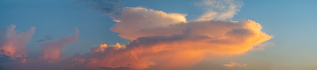 Clouds near sunset before rain blue sky Panoramic
