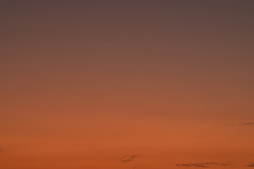 Orange horizon and blue atmosphere. Smooth orange blue gradient of dawn sky.