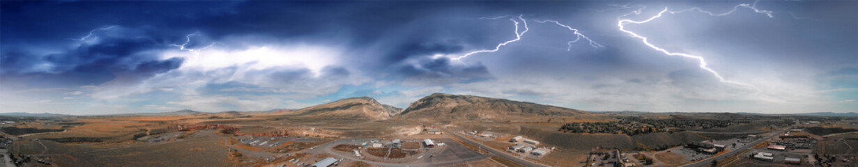 Aerial panoramic view of Cody landscape and Stampede Rodeo Park with storm approaching, Wyoming