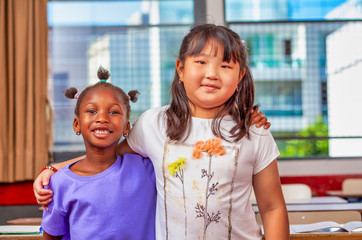 African and asian young girls at elementary school