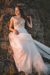 Beautiful bride outdoors in a forest.