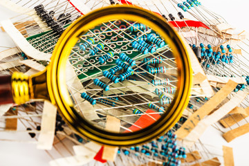 Fototapeta na wymiar Electronic components, resistors under a magnifying glass